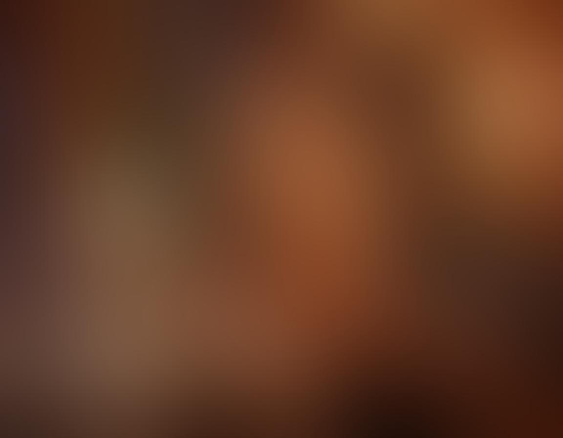 A seductive and tantalizing scene showcasing a glamorous webcam model in an intimate setting, surrounded by soft, warm lighting and elegant decor. Incorporate elements of digital technology, like a glowing laptop screen displaying a live chat interface, to emphasize the streaming aspect. The model should exude confidence and allure, with sultry expressions and stylish attire that captivates the viewer. A sense of luxury and sophistication should permeate the image, illustrating the modern evolution of adult entertainment. super-realistic. warm tones. vibrant colors.